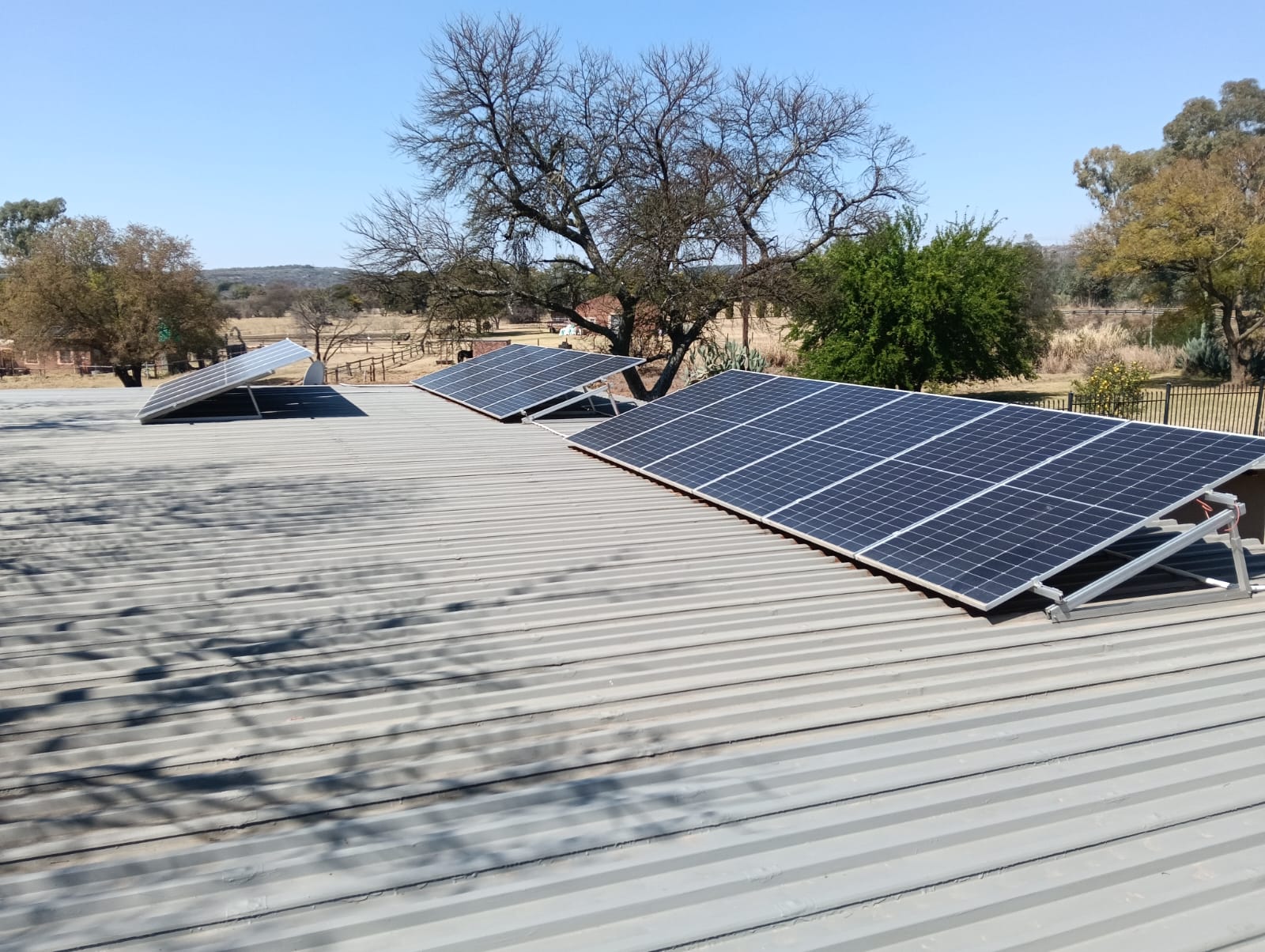 Row of solar panels installed on a farmhouse roof