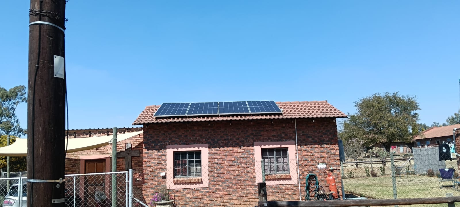 Solar panels installed on a red tile roof