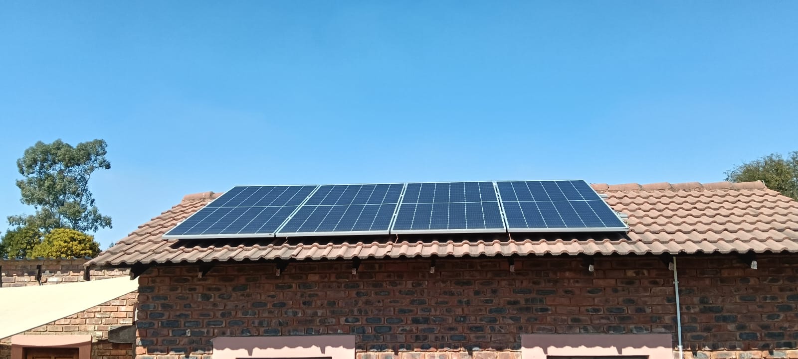 Close-up of solar panels on a tiled roof