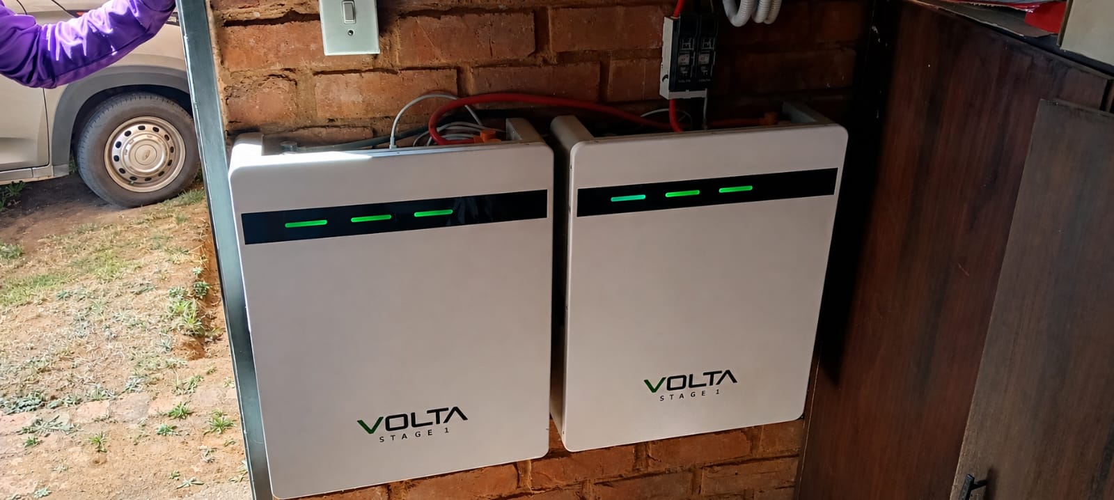 Volta battery storage units installed on a brick wall